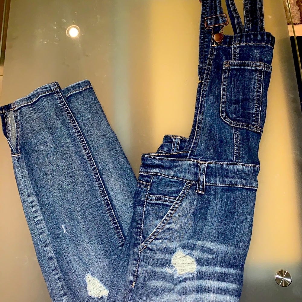 Ripped denim overalls